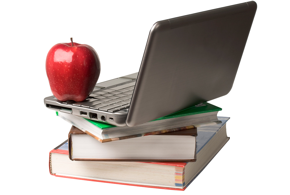 Apple, laptop and books